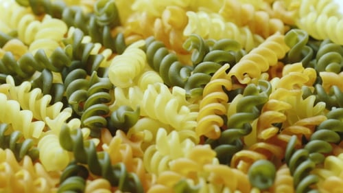 Colorful Uncooked Rotini Pasta Food Close Up