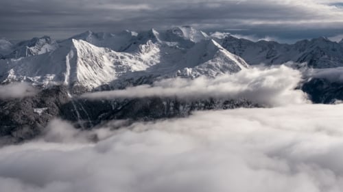 Aerial View of Mountains and Cloud-Covered Valley