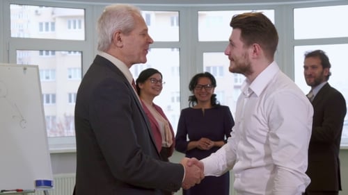 Businessmen Shakes Hands at the Office