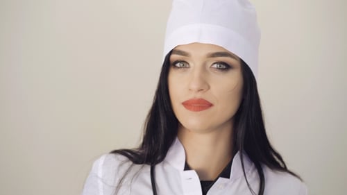 Young Woman Doctor Close Up in Medical Coat