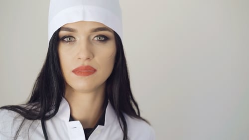 Elegant Medical Professional in Lab Coat and Cap