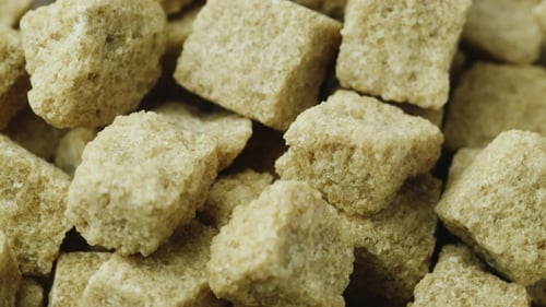 Unrefined Brown Sugar. Cubes Are Rotating