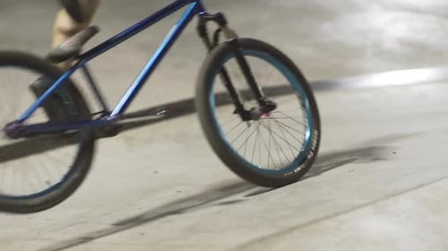 MTB Bicycle Rider Does Various Tricks While Riding in Skatepark
