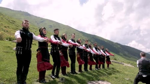 People in Traditional Clothes Perform Mountain Dance