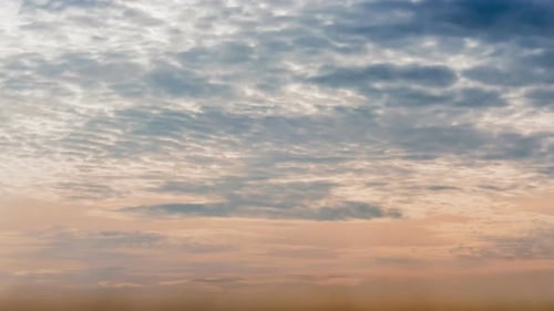 Time lapse sunset sunrise and beautiful twilight fluffy storm cloudy blue and yellow sky
