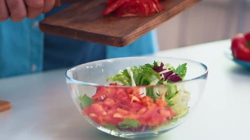 Fresh Salad Preparation in Bright Kitchen