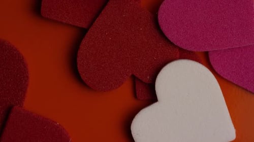 Rotating stock footage shot of Valentines decorations and candies - VALENTINES 0091