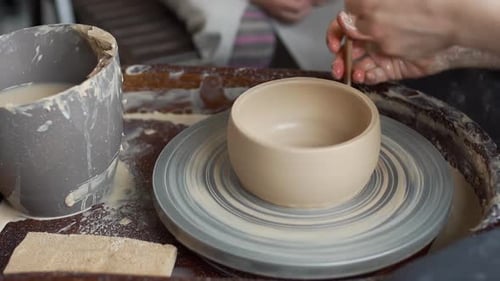 Hands Shaping Clay Bowl on Pottery Wheel
