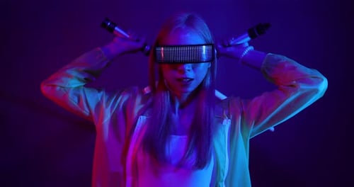 Young Asian woman playing metaverse virtual reality digital technology game with VR goggle.