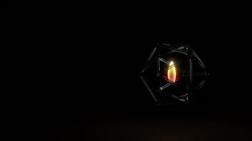 Candle light burning in metal sphere.