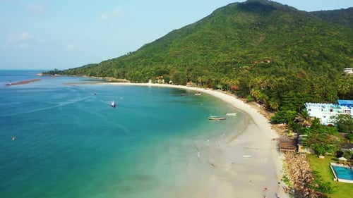 Aerial drone shot scenery of exotic seashore beach adventure by blue green sea and white sand backgr