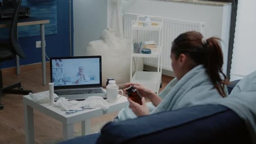 Woman Having Telehealth Appointment in Her Living Room