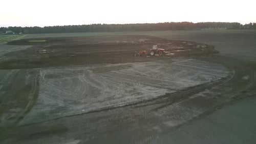 Cultivator Works in Field with Plough at Farmland Aerial