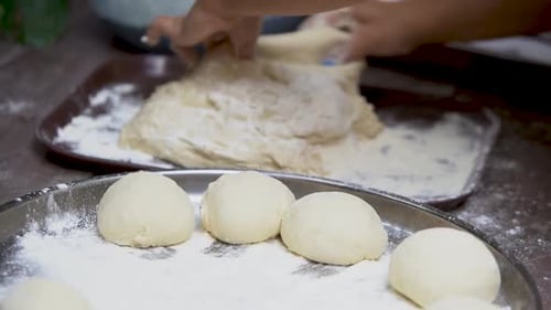 Fresh raw dough preparation. Uncooked dough balls.