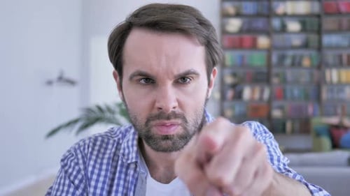 Pointing Gesture By Casual Beard Man Selecting with Aim of Finger