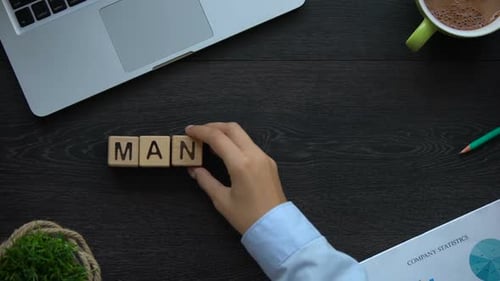 Assembling 'Management' Blocks on Wooden Desk