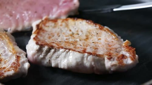 Pork Chops Cooking in a Pan