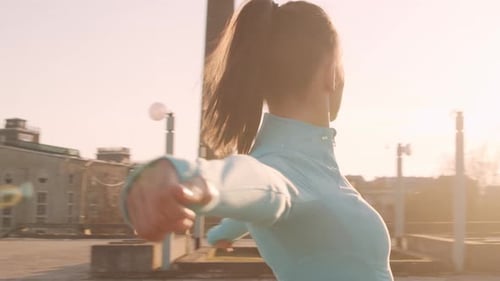 Young Adult Woman Stretching Arms and Shoulder Muscles