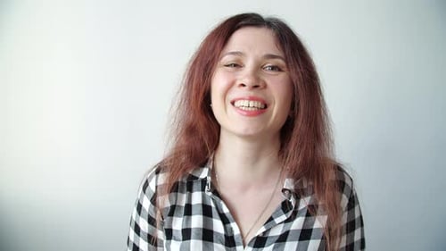 Woman Laughing Cheerfully at the Camera
