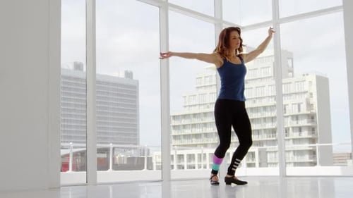 Woman Dancing Tap in Bright City Studio