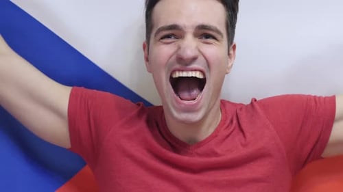 Man Celebrating Patriotism with Flag