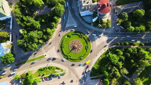 Aerial View Timelapse of Roundabout Road with Circular Cars in Small European City at Sunny Summer