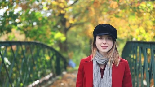 woman in coat in park. Autumn time