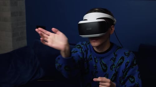 Man Using VR Headset for Interactive Gaming Experience