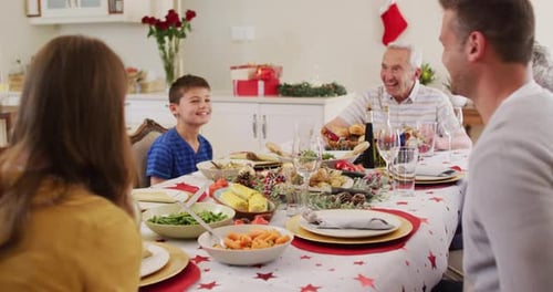 Family Celebrates Christmas Dinner at Home