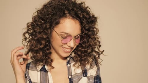 Smiling Woman Wearing Round Pink Glasses and Flannel