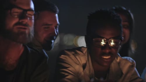 Friends Singing and Playing Guitar at Night