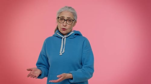Adult Woman Gesturing and Explaining in Studio