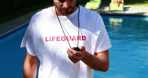 Lifeguard Stands by Pool on Sunny Day