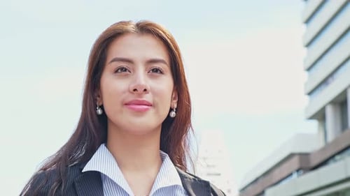 Asian young beautiful smart businesswoman walking outdoors to working in company office in city.