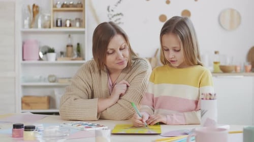 Mother and Daughter Drawing Art Together at Home