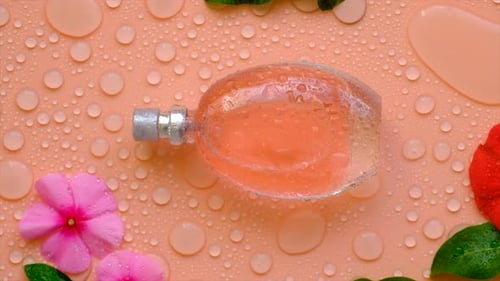 Background with Perfume Water Drops and Flowers