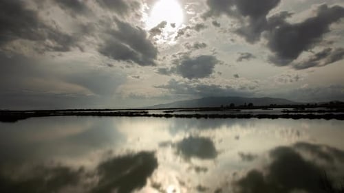 Timelapse Footage of Moving Clouds Reflected in Sea