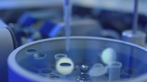 Automated Laboratory Machine Deposits Liquid Samples