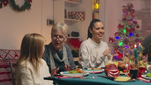 Family Christmas Celebration at Home Around Dinner Table