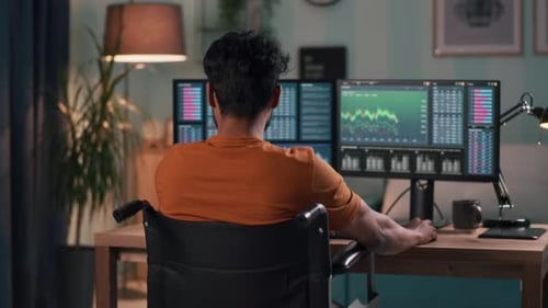 Anonymous Trader on Wheelchair Using Computer