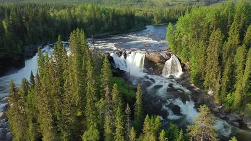 Breathtaking Waterfall Cascades Through Lush Forest