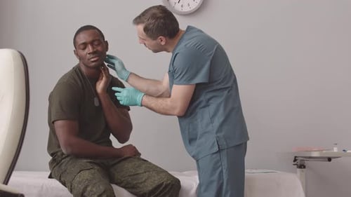 Doctor Examining African American Army Officer