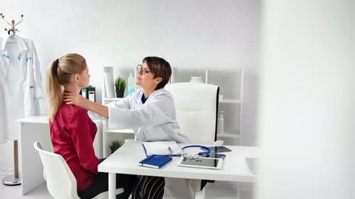 Doctor Examining Patient in Modern Medical Office