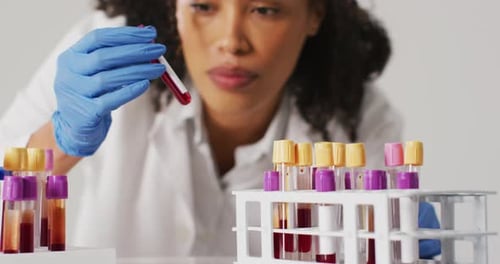 Scientist Examining Blood Sample in Test Tube