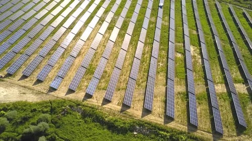 Aerial view of solar power plant field. Electrical photovoltaic panels for producing clean ecologic