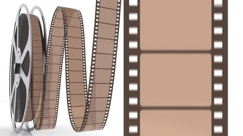 Film reel and filmstrip rolling at the screen with cinema bobbin on the white