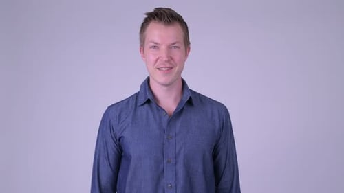 Man in Blue Shirt Smiles
