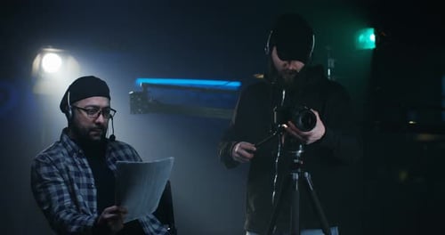 On Set: Adjusting Camera and Reviewing the Script