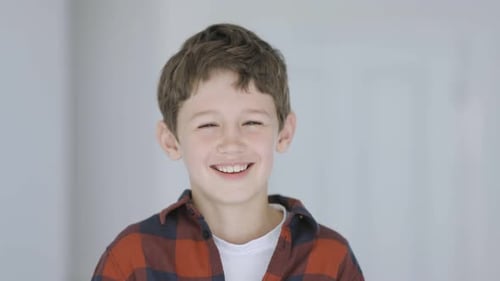 Cute little boy laughing heartily