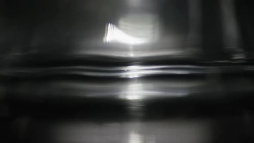 Wavering Reflected Light on Dark Surface